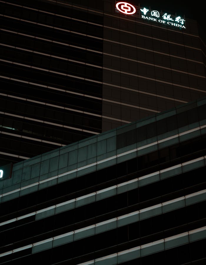 creative Dramatic night view of Bank of China skyscraper in Bangkok, showcasing modern architectural lines.